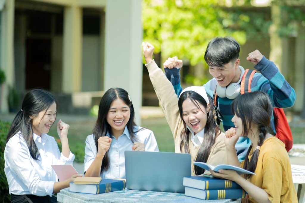 Group students studying campus outdoors